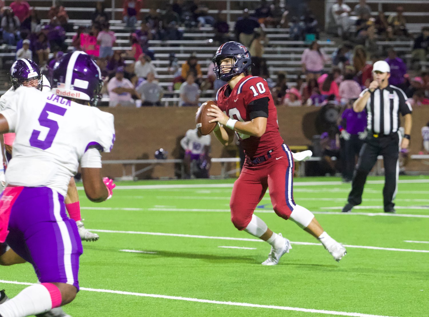 Wyatt Young looks to pass during Thursday's game between Tompkins and Morton Ranch at Rhodes Stadium.